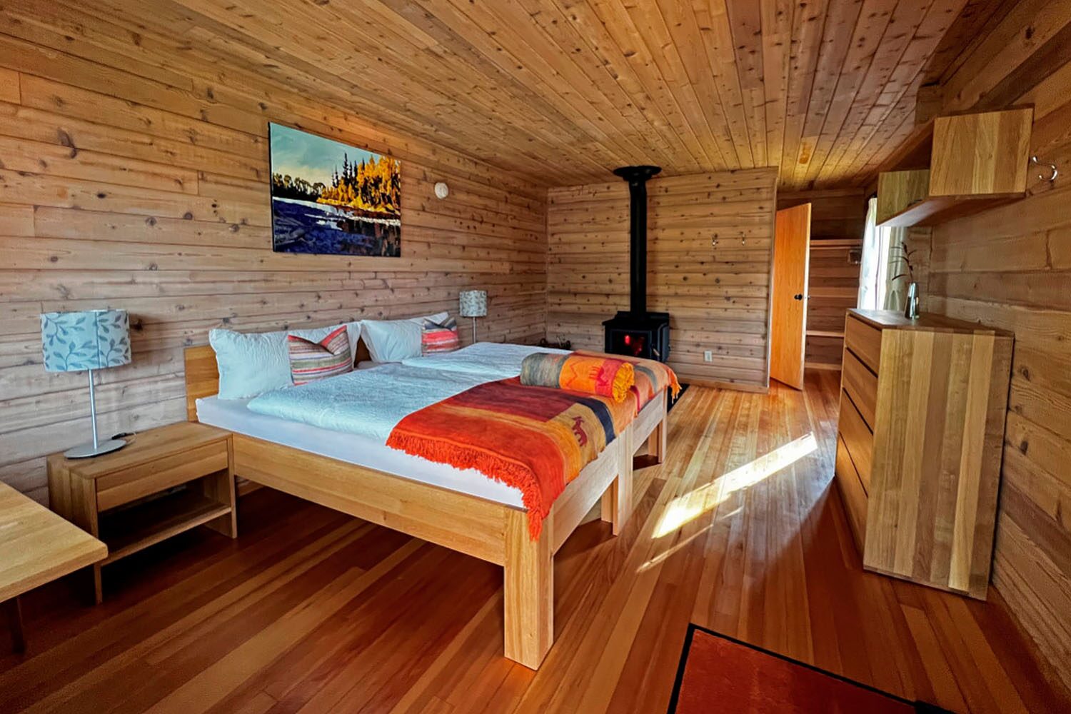 Bedroom in wooden wilderness lodge, Canada