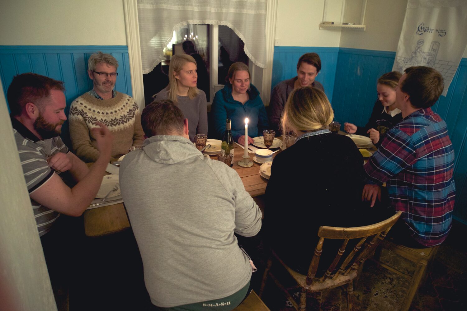 Full table of guests dining together at farmhouse style dining table wilderness center hotel.