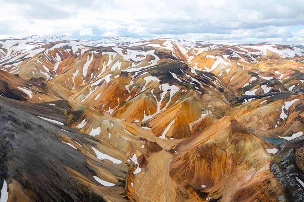Landmannalaugar Ariel Mountains covered in snow ariel shot
