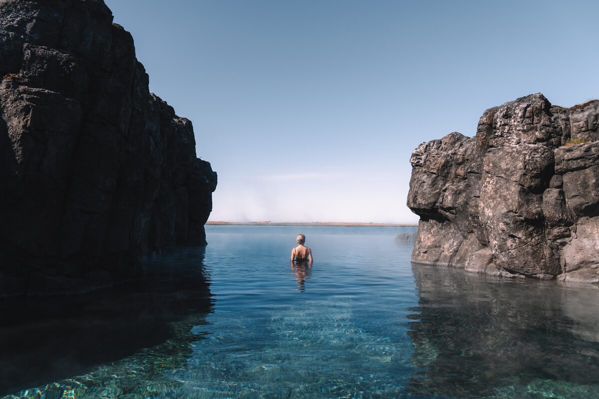 Woman bathing in hot blue lagoon