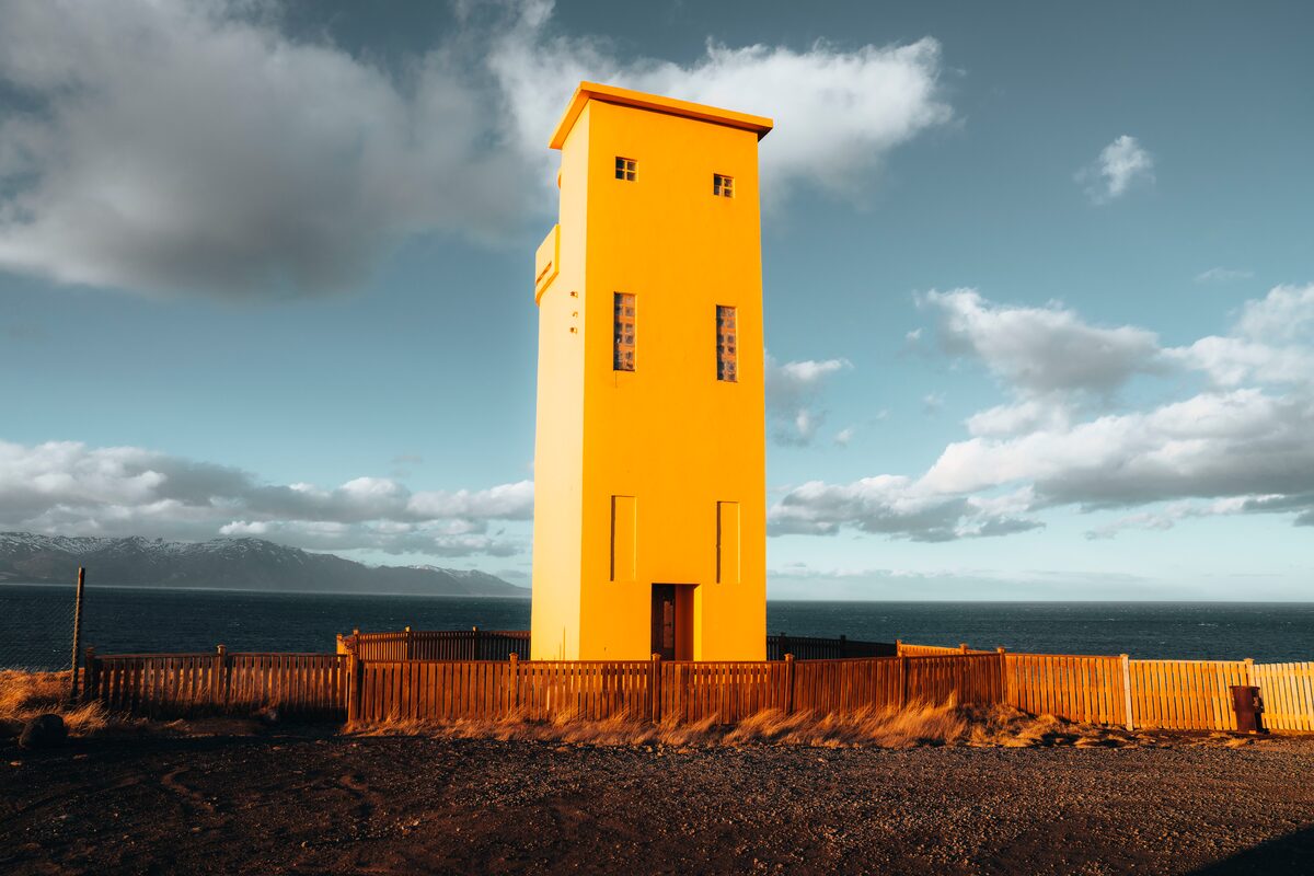 Yellow Lighthouse Cloudy Sky