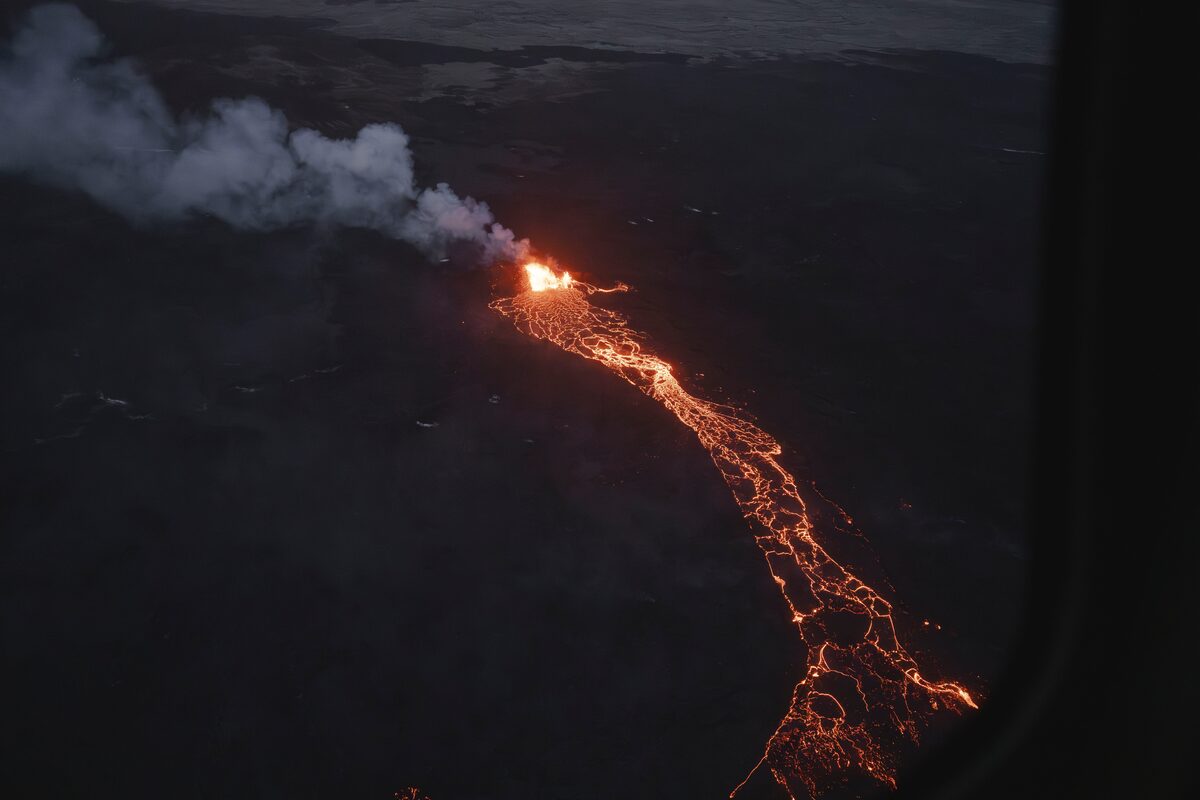 Nordurflug active volcano lava patterns forming smoking from heat during night 