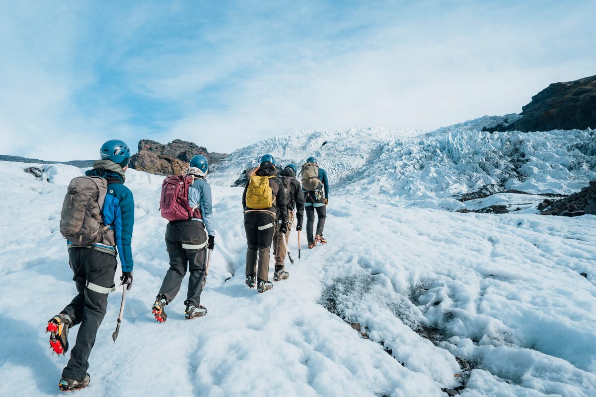 Small group tour hiking towards glacier crevasses at Vatnajokull.