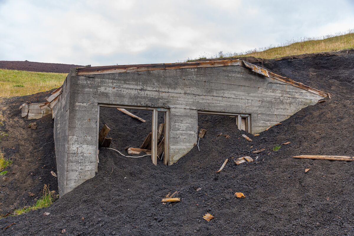 Ruins of burired house in eruption lava at Eldheimar museum in Heimay island.