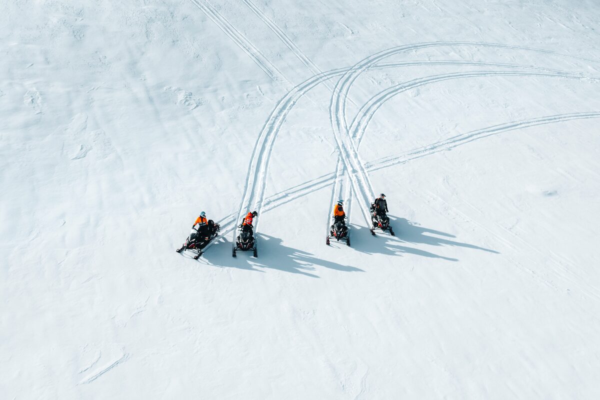 Four Snowmobiles Stopped On The langjokull Glacier