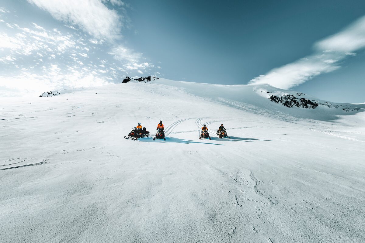 Snowmobiling Crew Driving On The Langjokull Glacier