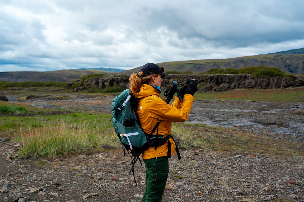 Woman Hiker Taking Pictures On Laugavegur Trail in iceland