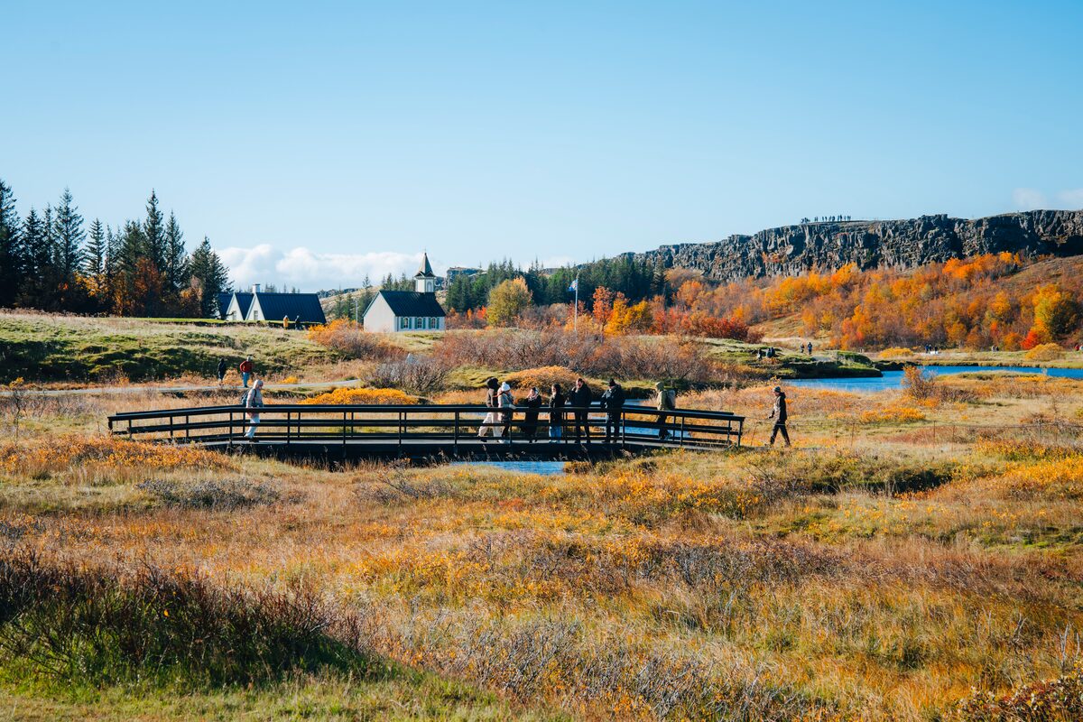 People Walking On A Bridge At Thingvellir National Park in iceland