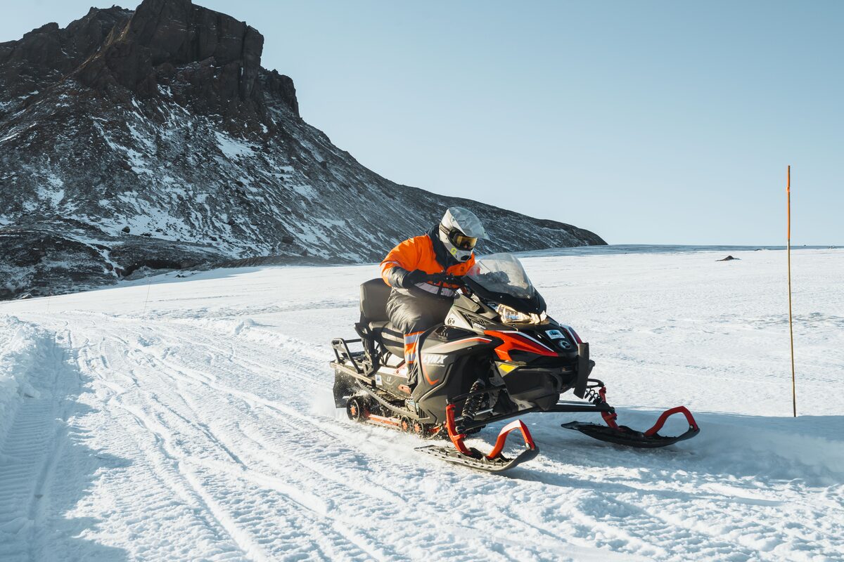 Man On A Snowmobile On A Glacier In Iceland