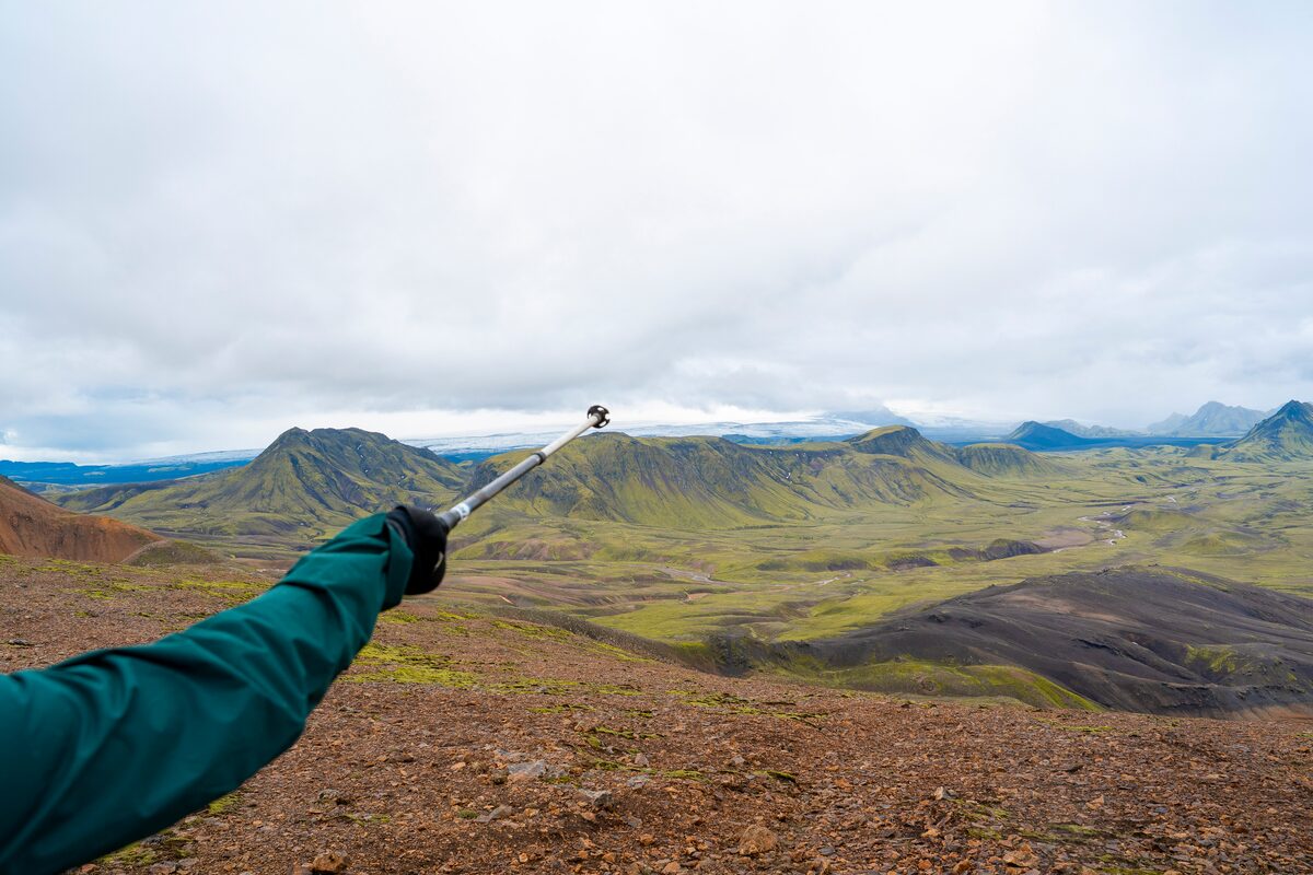A Person Pointing With A Walking Stick At Laugavegur in iceland