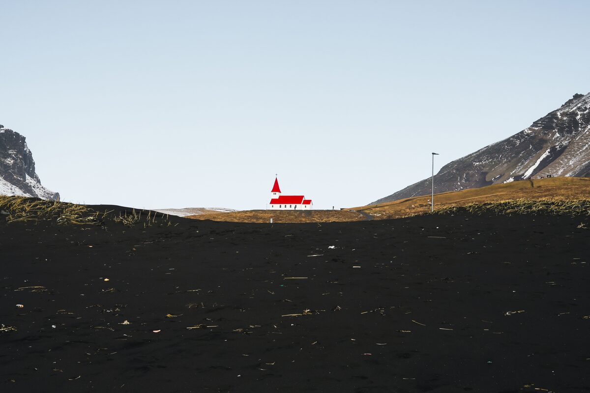 Vik Y Myrdal Church View From A Black Sand Beach in iceland