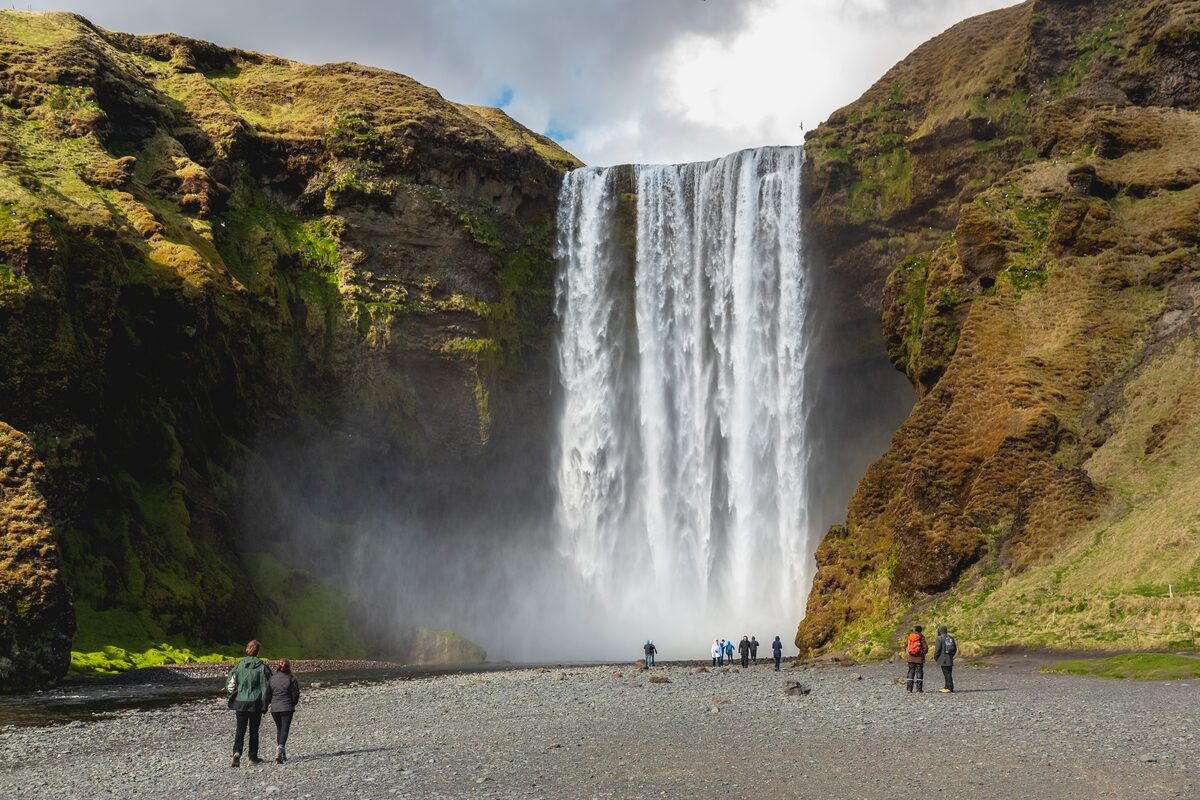 Tourists At Skogafoss Waterfall in iceland