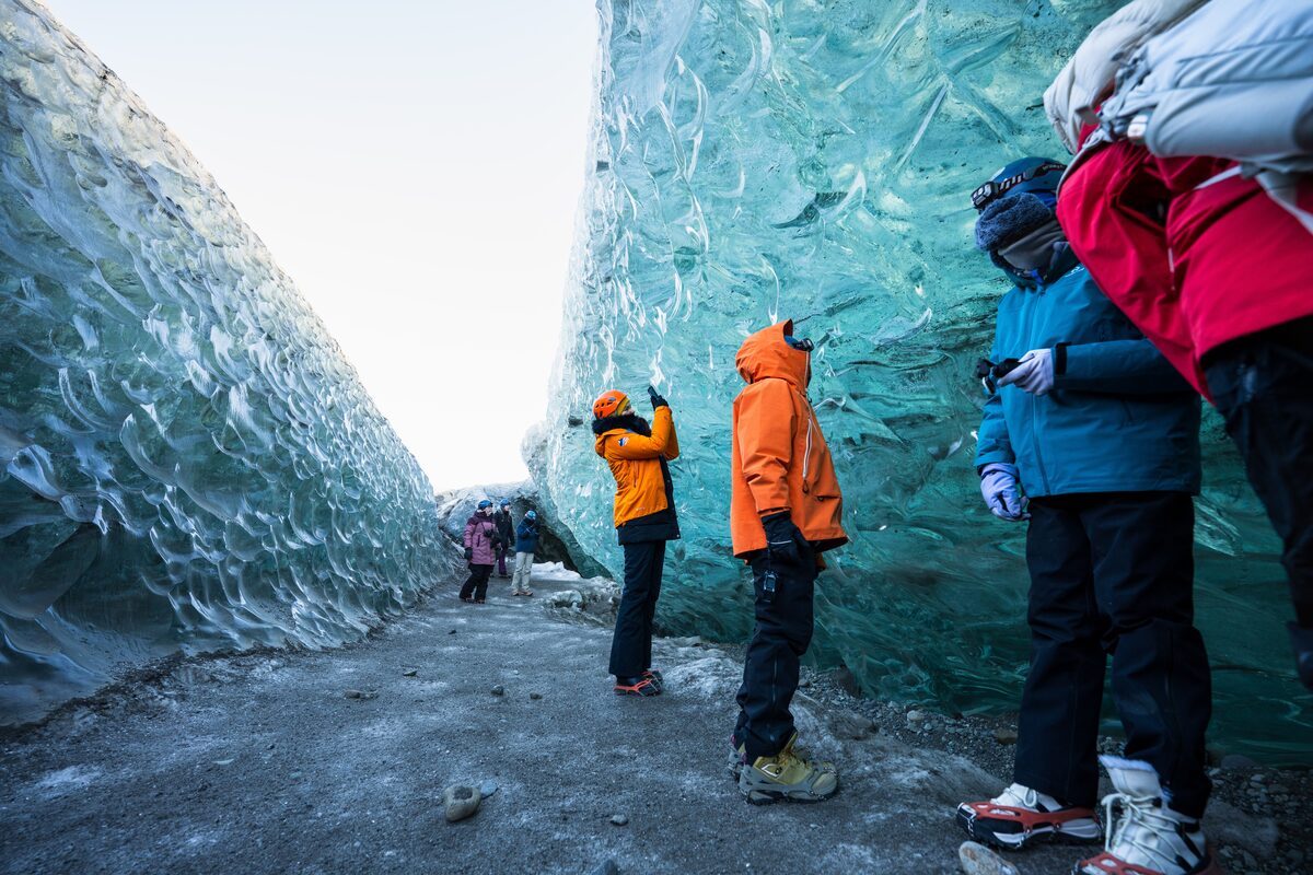 Tourists At Crystal Ice Cave in iceland