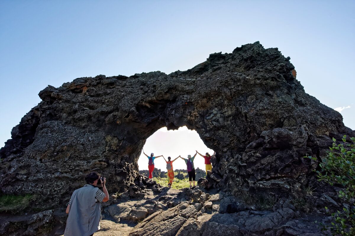 Man Photographing Women At Dimmuborgir Lava Field in iceland
