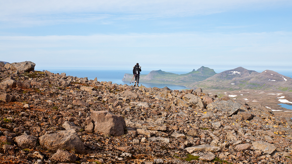 Hiker On A Hill Made Of Rocks in Iceland