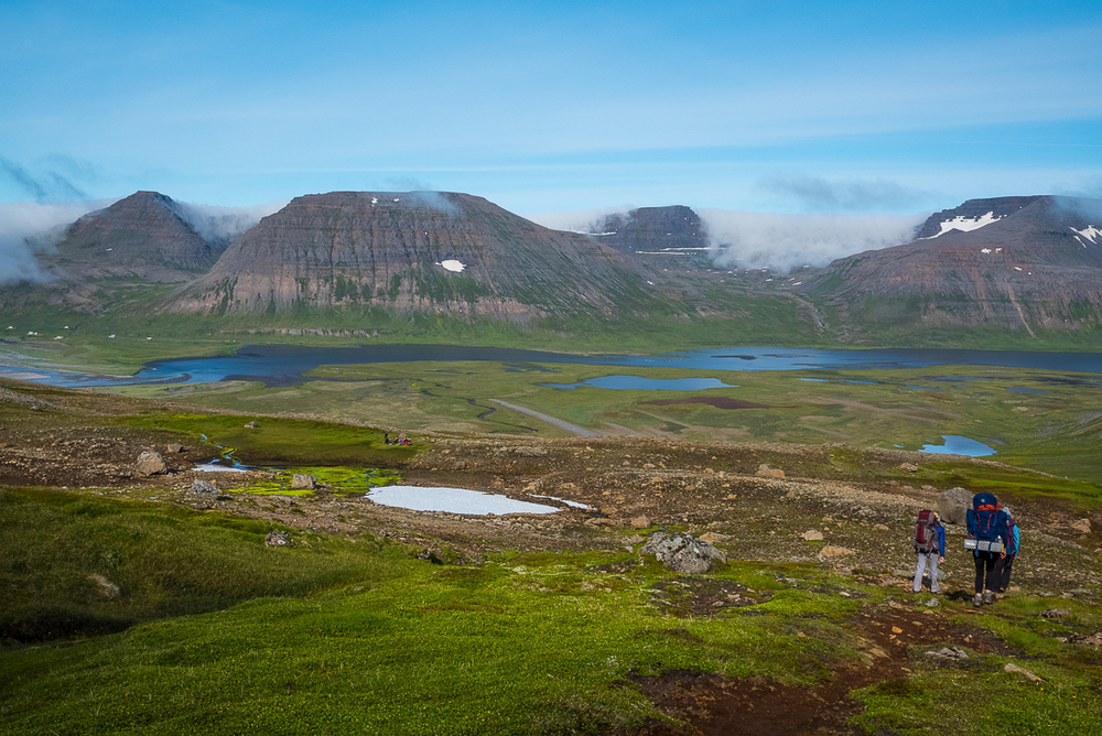 Hikers With A Panoramic View Of Hornstrandir Nature Reserve in Iceland
