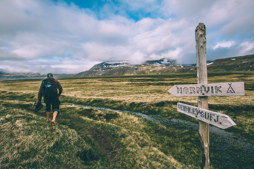 Sign And A Hiker At Hornstrandir Nature Reserve in Iceland