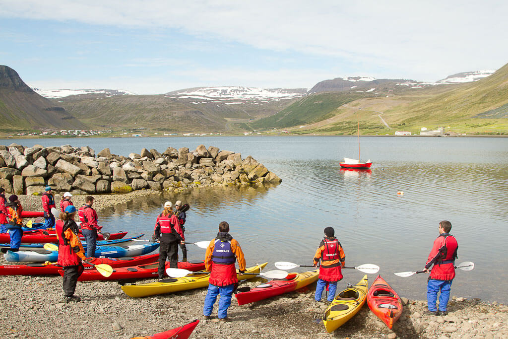 Kayakers Preparing To Go Kayaking On The Shore in Iceland