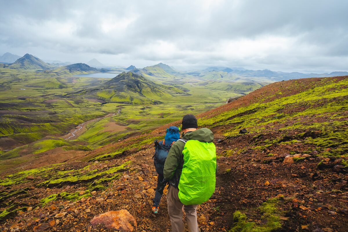 Hikers Going Down A Trail At Landmannalaugar in Iceland