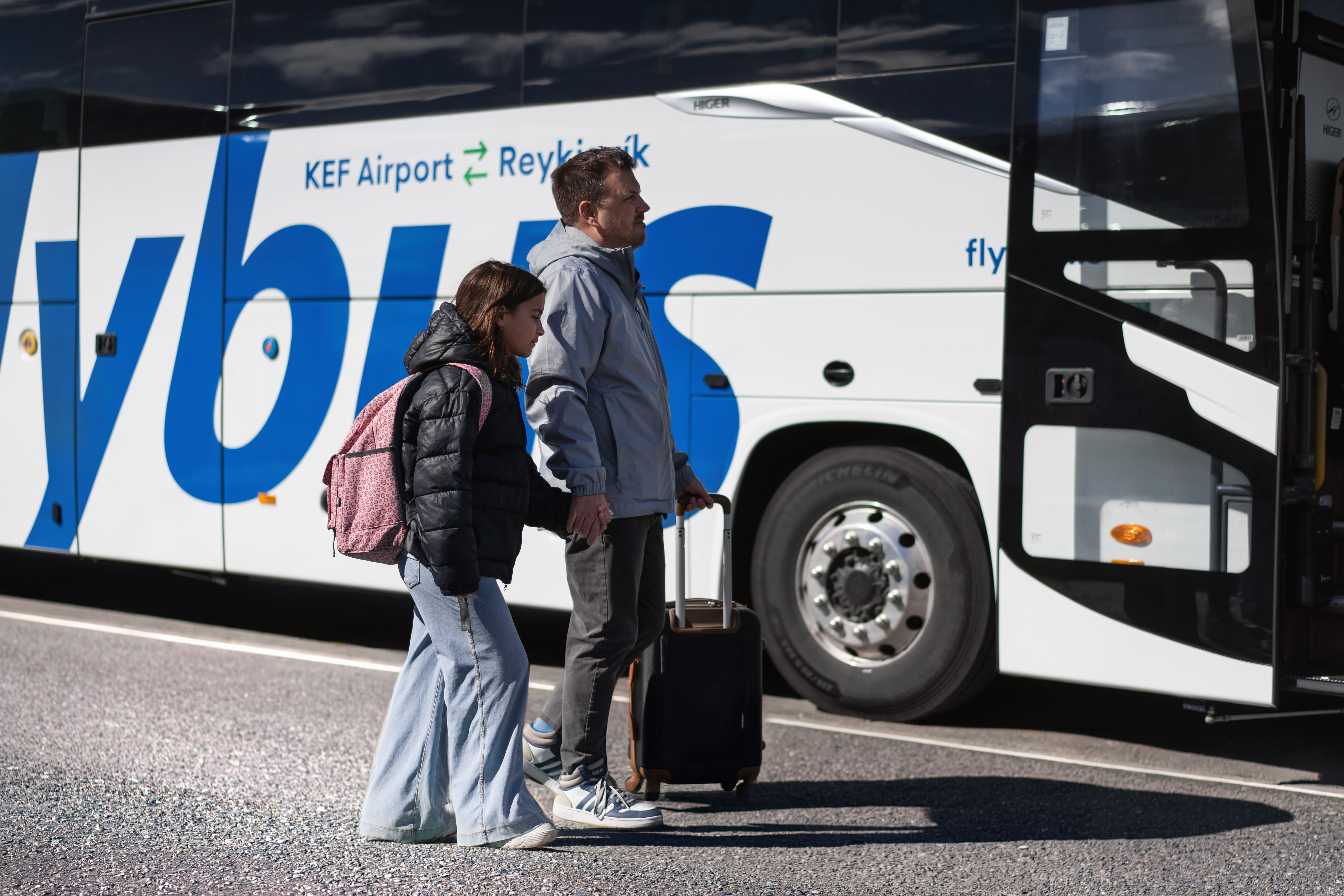 Father And Daughter Going To Flybus Bus in Iceland