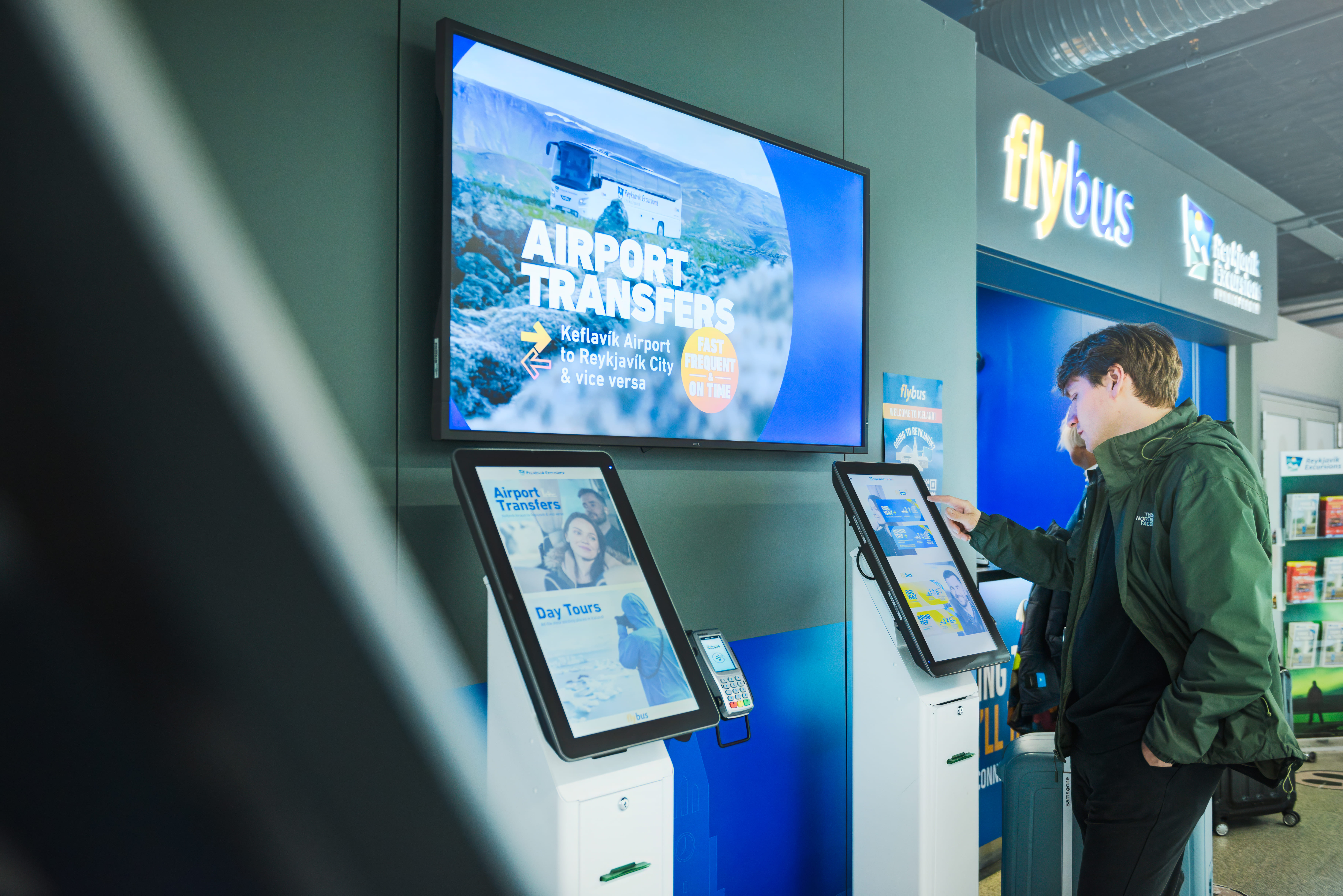 Person At A Self Check Out Buying A Bus Ticket in Iceland