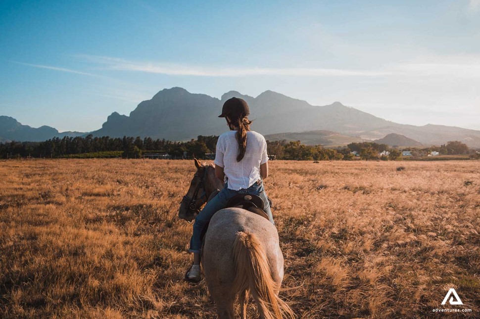 Girl on a Horseback Ride Back view