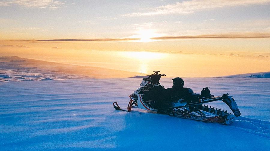 Snowmobile at sunset