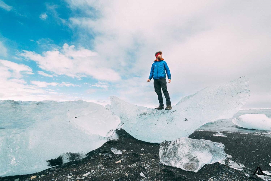 Man Standing on Melting Iceberg