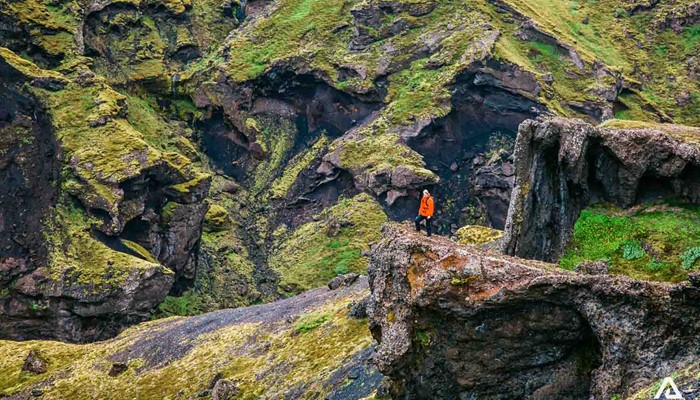 Woman standing on Thorsmork cliff