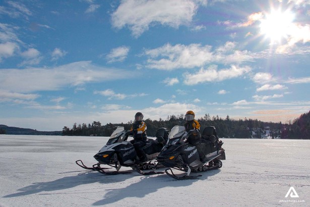 Snowmobiling in the sunny day
