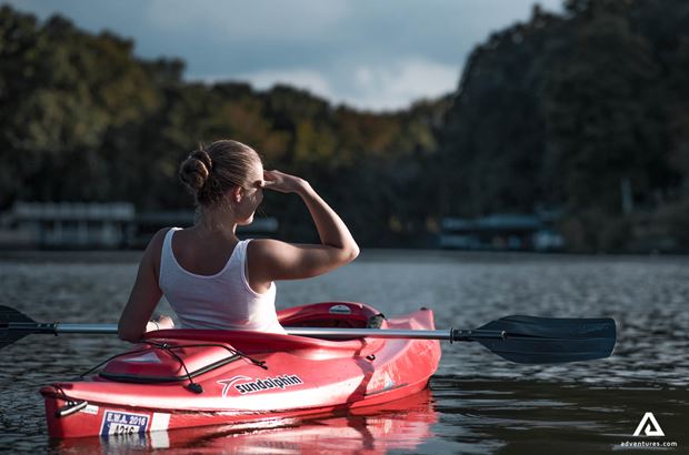 Woman Looking Forward on Kayaking Girl in red kayak