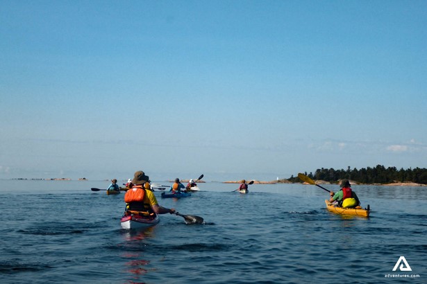 People Kayaking In The Ocean 