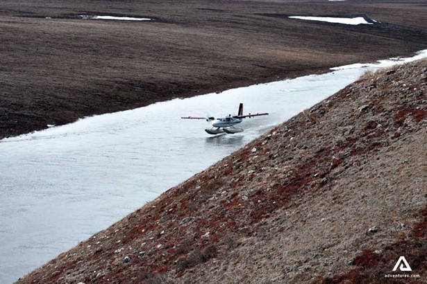 plane landing on a river in nunavut