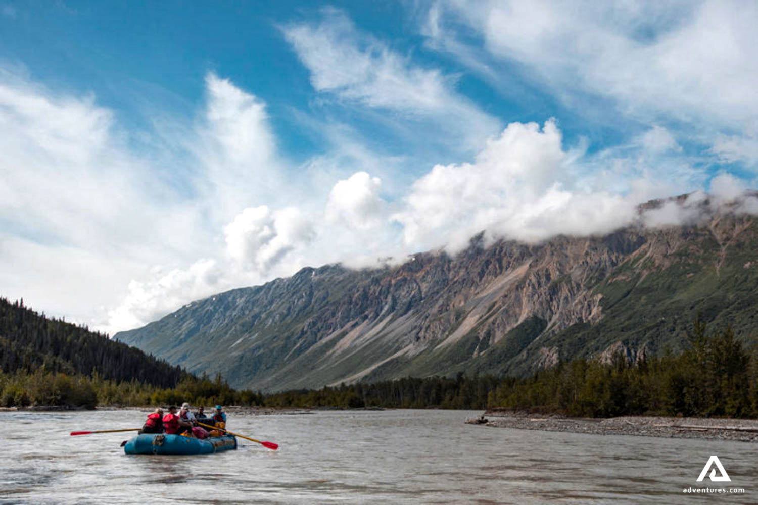 rafting near a mountain range in canada