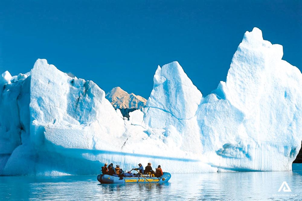 rafting near a large iceberg