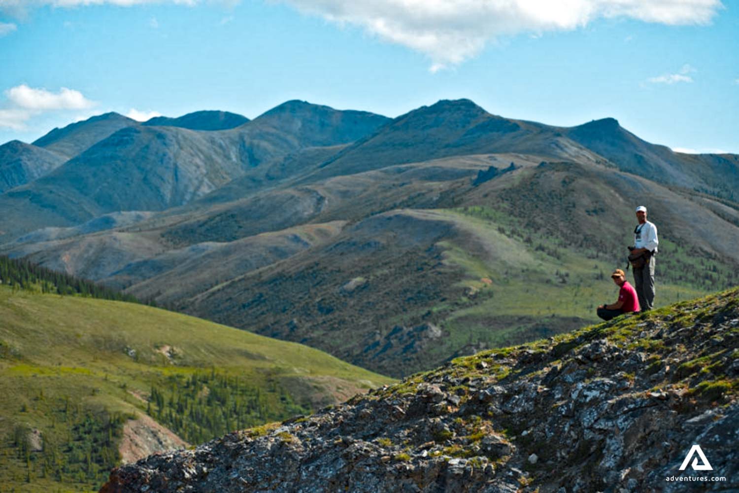 hikers at a mountain range in summer