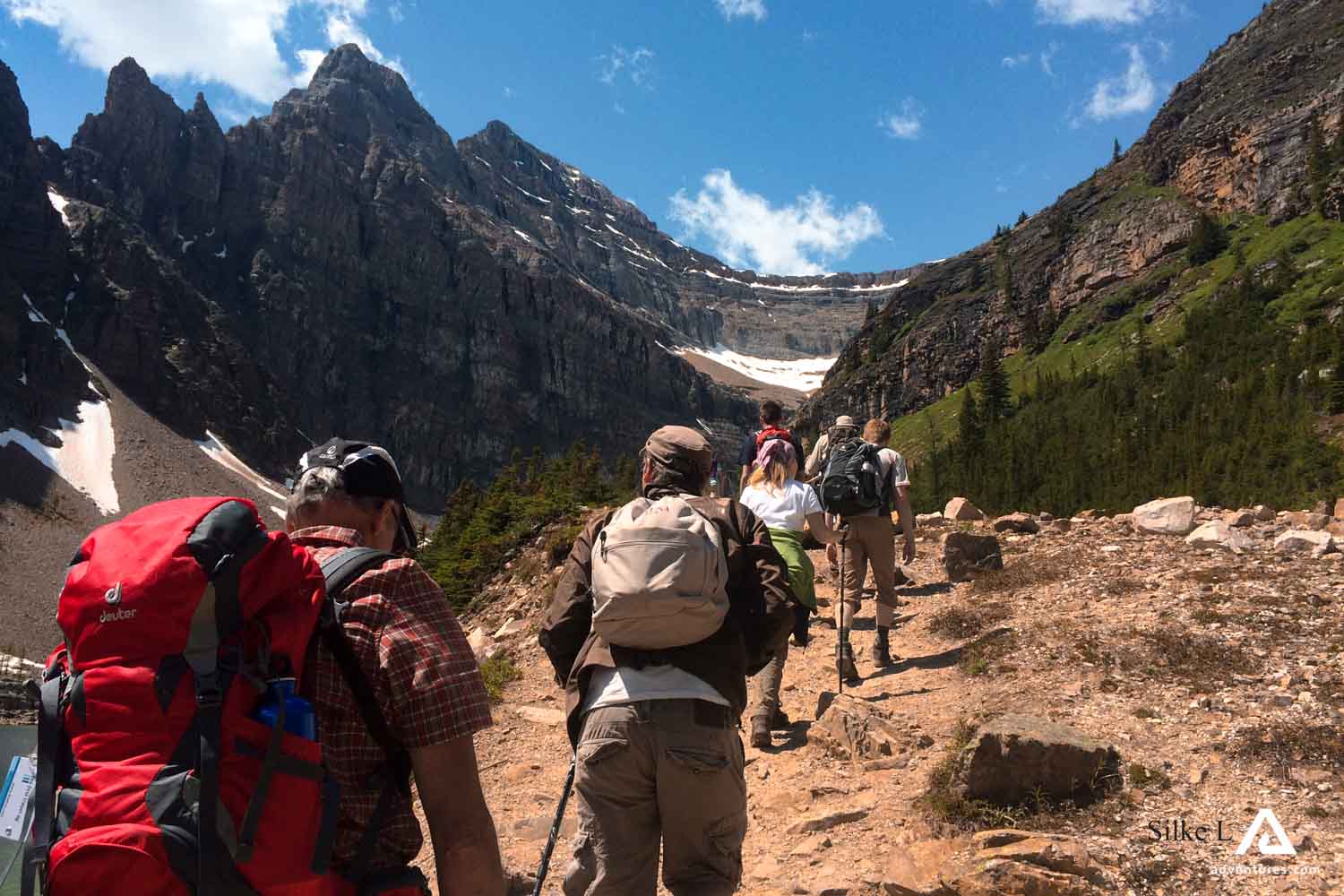 group of backpackers in mountains hiking