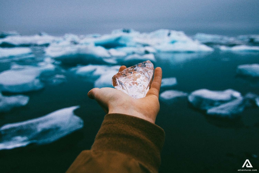 holding a piece of ice 