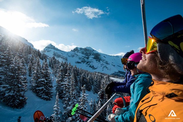 Happy people on a ski lift