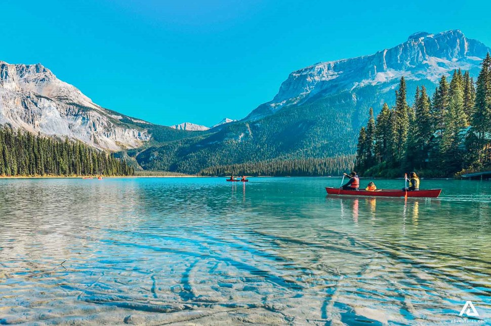 People Canoeing In Canadian Rockies