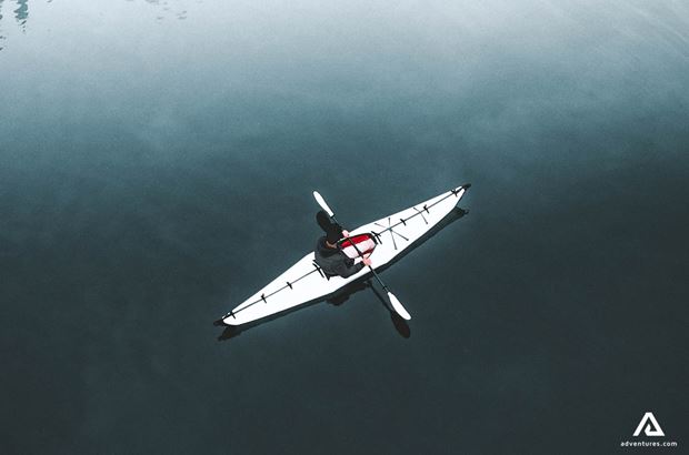 aerial view of a kayaker aerial view of a kayaker in a white kayak