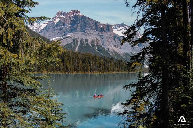 Canoeing on the Lake around Mountains