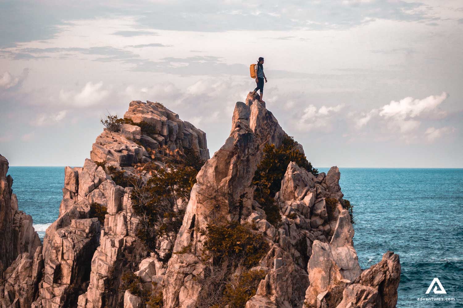hiker on very steep cliffs in canada
