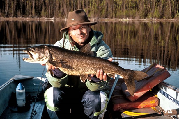 showing a big caught fish in yukon canada