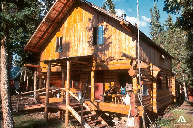 large wooden lodge in yukon canada at summer