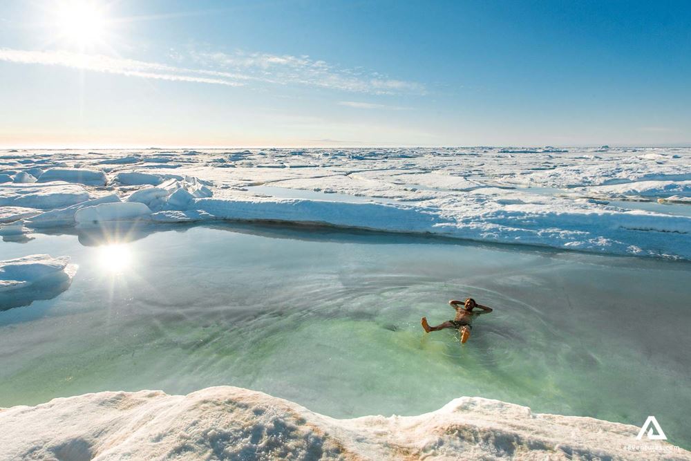 happy man relaxing in glacial water