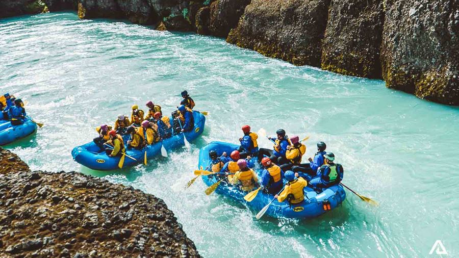 Group Of People Are Rafting In Iceland On River