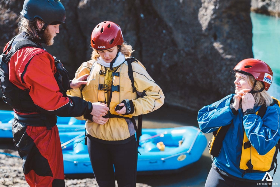 Three People Are Preparing For Rafting In Iceland