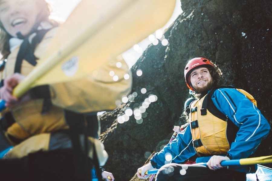 Two People Are Rafting With Yellow Life Jackets