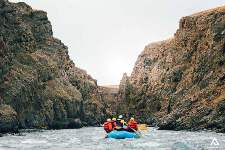 Glacial River Rafting Between Rocks In Iceland
